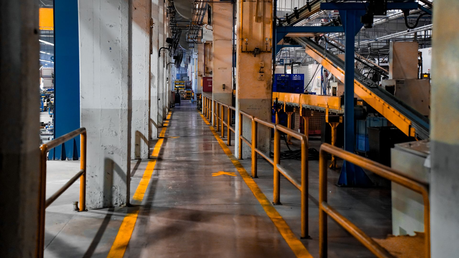 Real production workshop with marked access aisles and industrial machinery